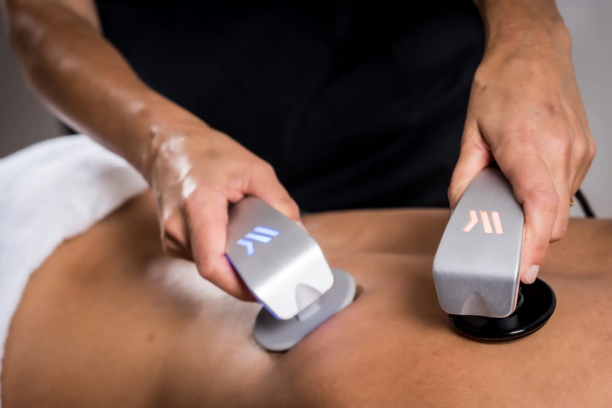 Two Winback handpieces treating a patient